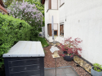 "Familienfreundliche 4-Zimmer-Wohnung mit Terrasse und Gartenanteil" - Terrasse mit Gartenanteil