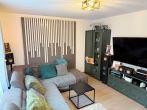 "Familienfreundliche 4-Zimmer-Wohnung mit Terrasse und Gartenanteil" - Wohnzimmer